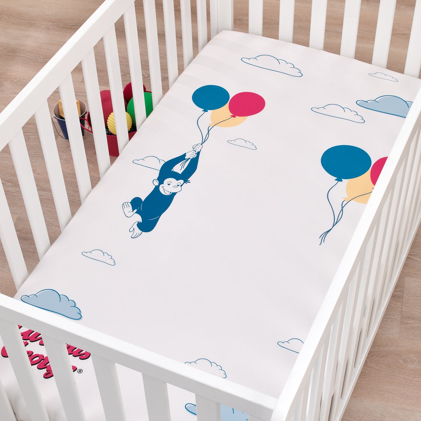 Welcome to the Universe Baby Curious George Blue, White, Red, Yellow and Green Up In The Clouds with Balloons Photo-Op Nursery Fitted Crib Sheet