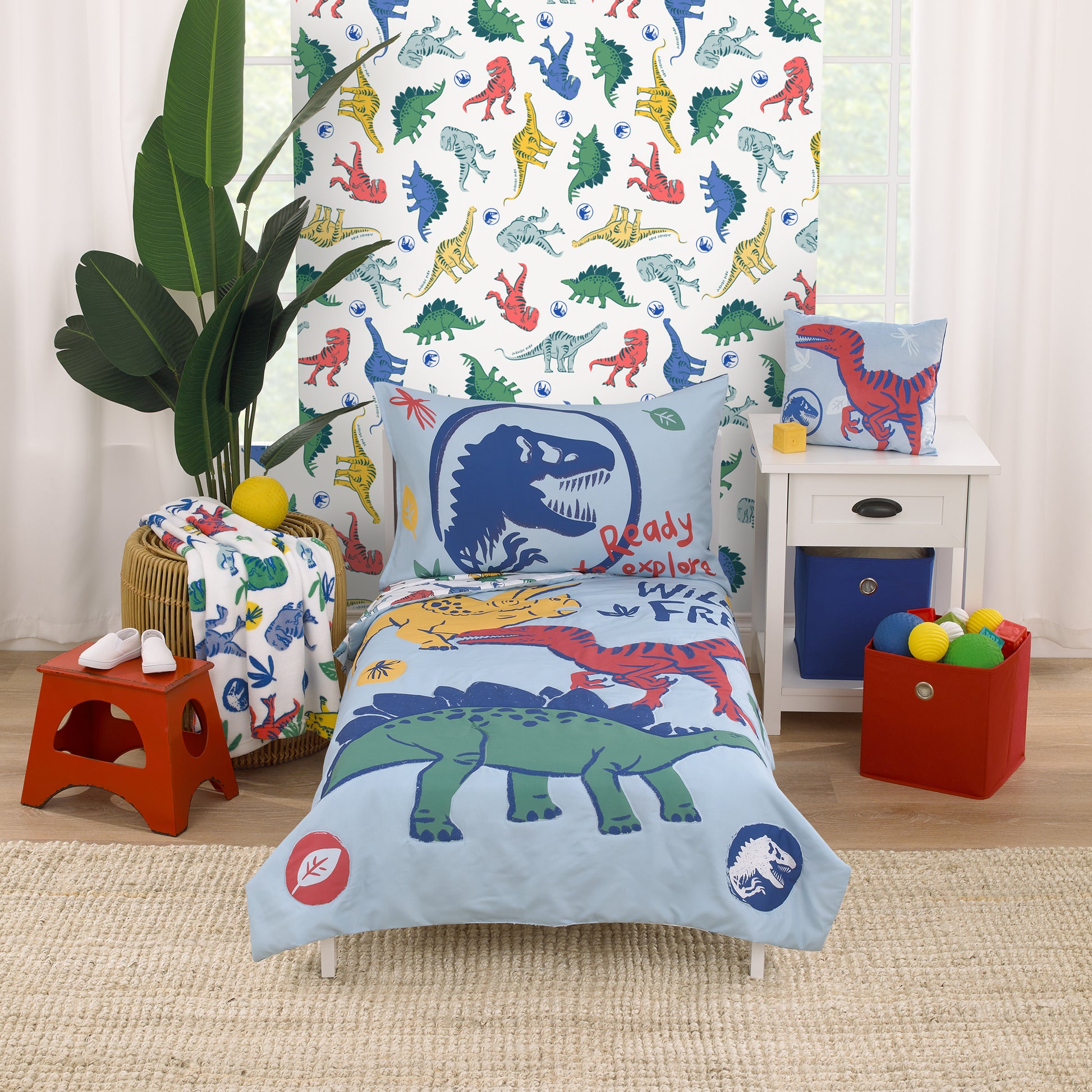 Universal Jurassic World Wild and Free Blue, Green, and Yellow Dinosaur 4 Piece Toddler Bed Set - Comforter, Fitted Bottom Sheet, Flat Top Sheet, Reversible Pillowcase
