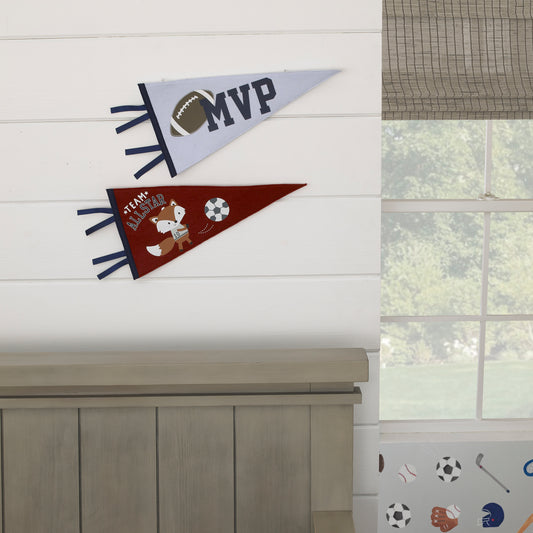 Two sport-themed felt pennants hanging on a wall, one with a fox design in grey, burgundy, and navy, and the other with a football and MVP text in light blue and navy.