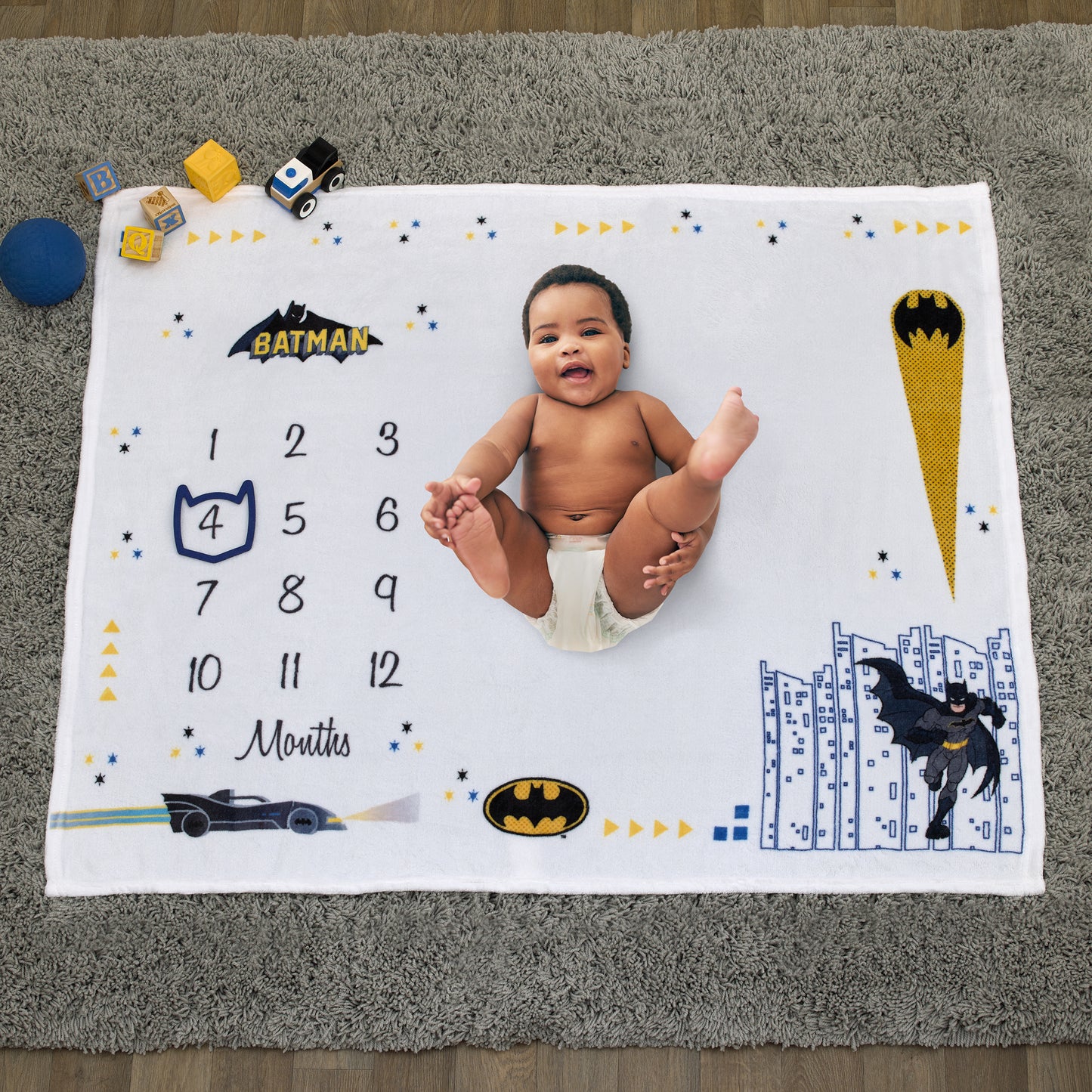 Warner Brothers Batman White and Black Batmobile, Gotham City, and Bat Signal Milestone Baby Blanket