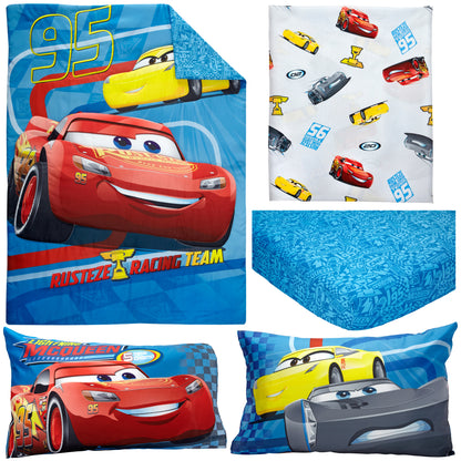 Disney Cars Rusteze Racing Team Blue, Red , and Yellow Amigo Cruz Ramirez and Jackson Storm 4 Piece Toddler Bed Set - Comforter, Fitted Bottom Sheet, Flat Top Sheet, and Reversible Pillowcase