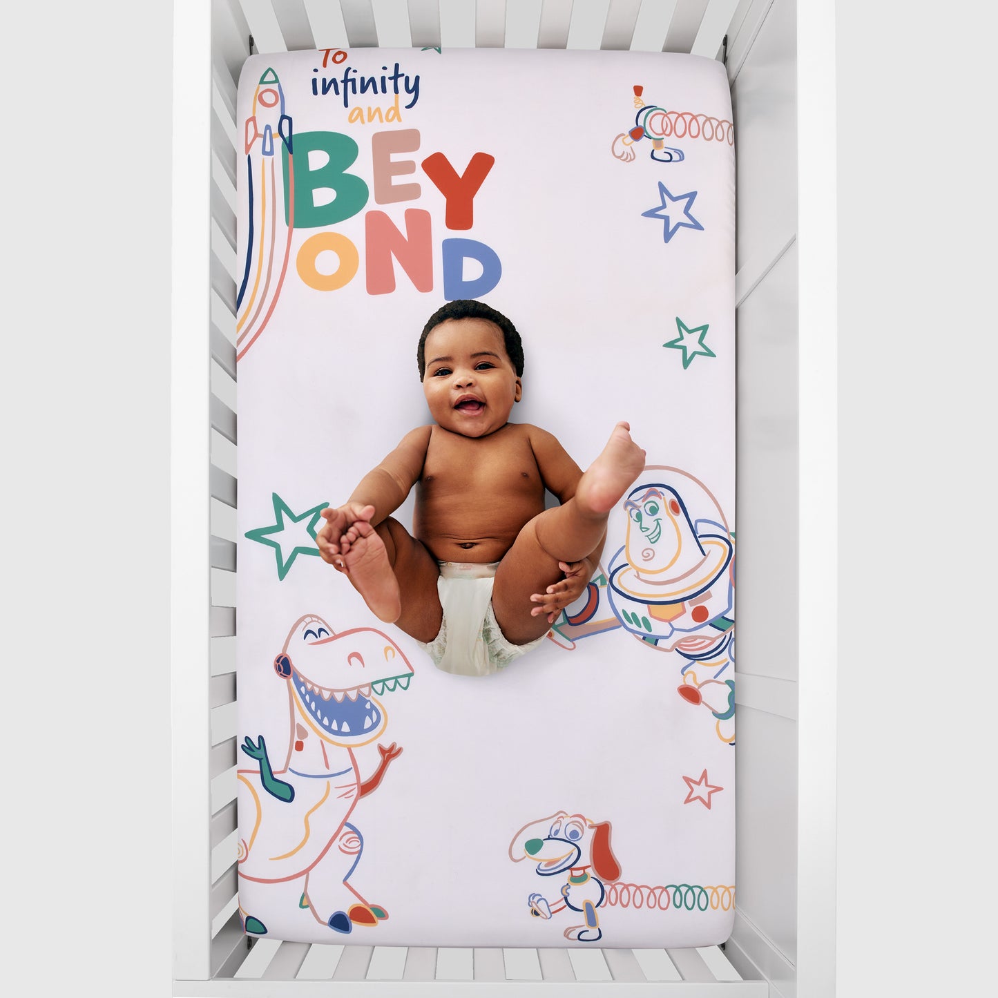 Disney Toy Story Green, Red, Blue and White "To Infinity and Beyond" Color Crazy Nursery Photo Op Fitted Crib Sheet