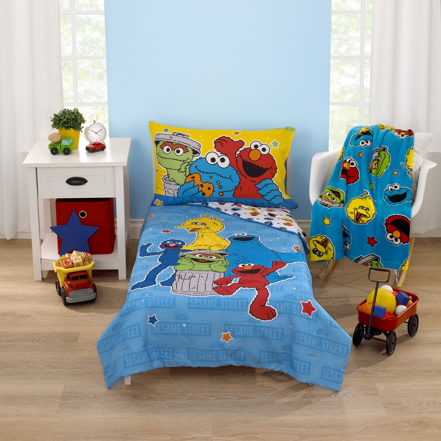 Sesame Street Come and Play Blue, Green, Red and Yellow, Elmo, Big Bird, Cookie Monster, Grover, and Oscar the Grouch 4 Piece Toddler Bed Set - Comforter, Fitted Bottom Sheet, Flat Top Sheet, and Reversible Pillowcase